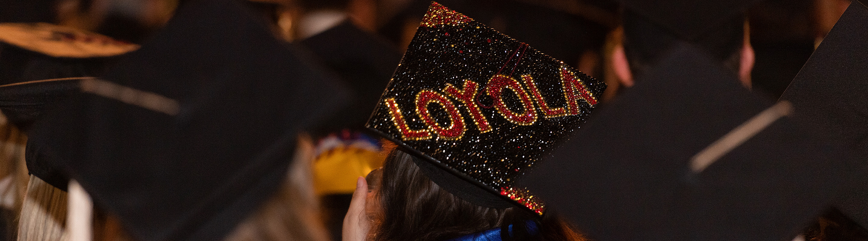 A mortar board sparkles with Loyola decor at Commencement.
